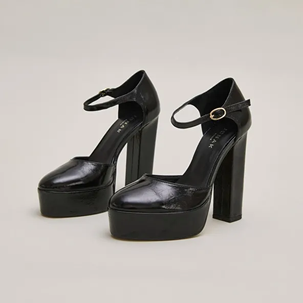 Heeled Mary Jane and platforms in black glazed leather