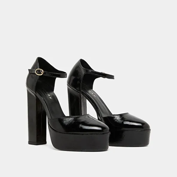 Heeled Mary Jane and platforms in black glazed leather