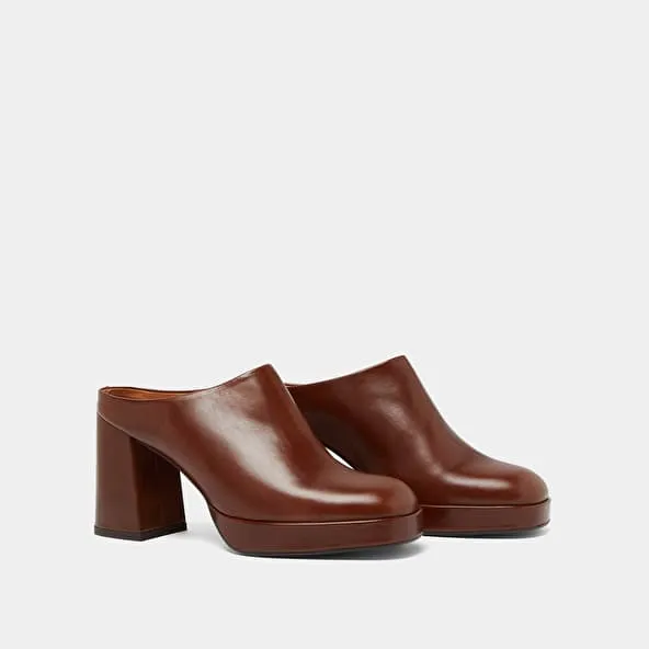 Heeled mules in brown leather